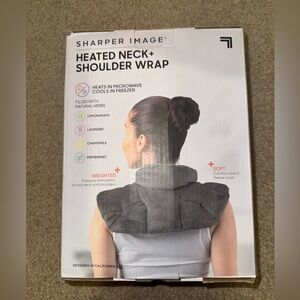 Sharper image weighted heated neck and shoulder wrap. Never used